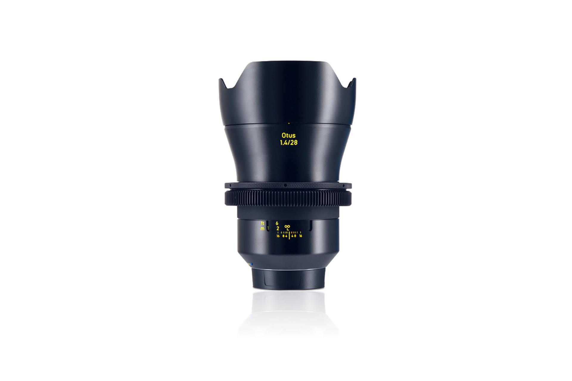 Front view of a ZEISS Otus 1.4/28 camera lens with focus and aperture markings.