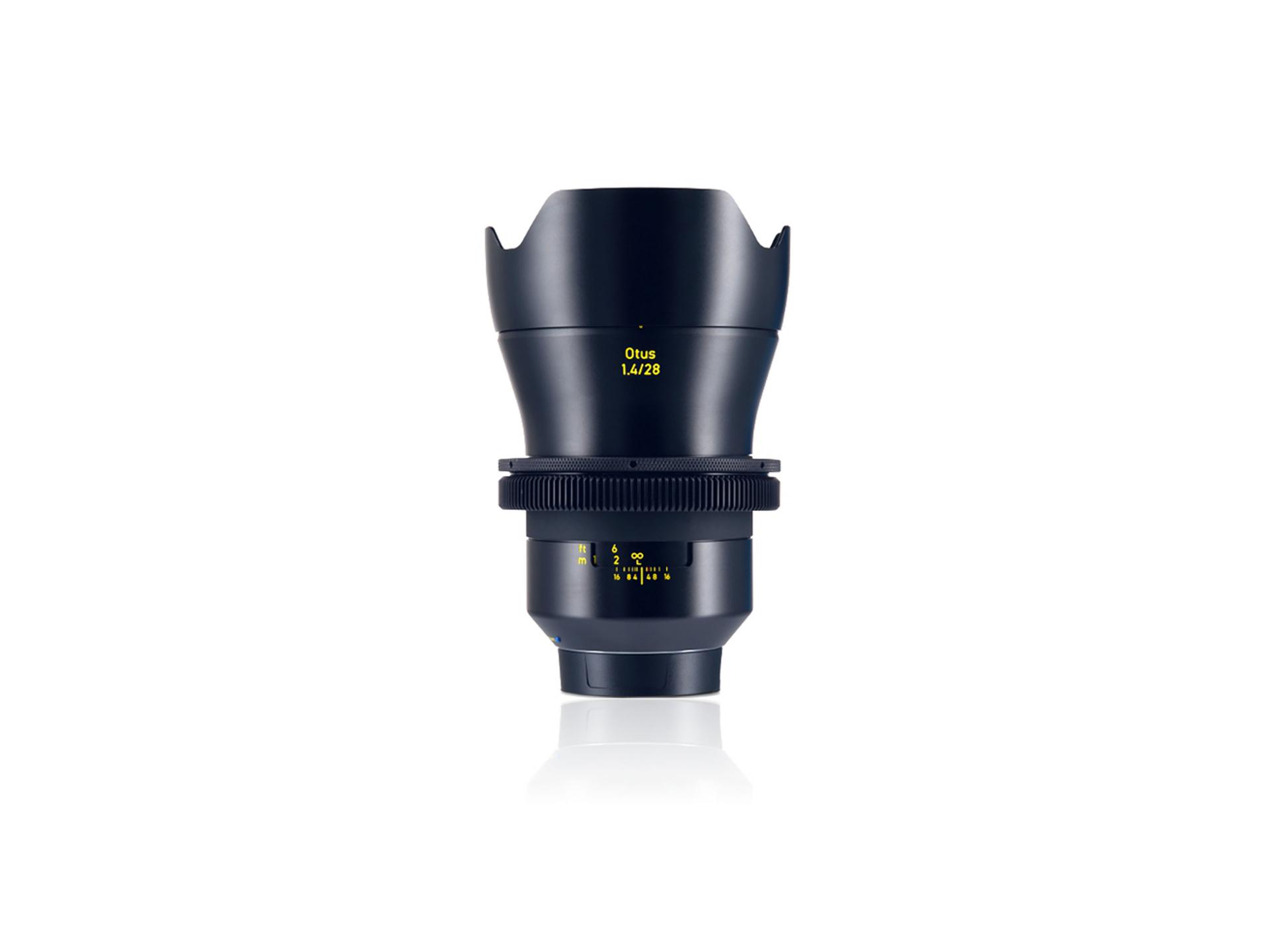 Front view of a ZEISS Otus 1.4/28 camera lens with focus and aperture markings.