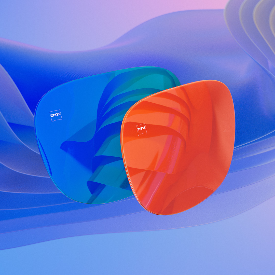 Ilustración en 3D generada por ordenador de dos lentes de sol con tratamiento espejado azul y naranja.