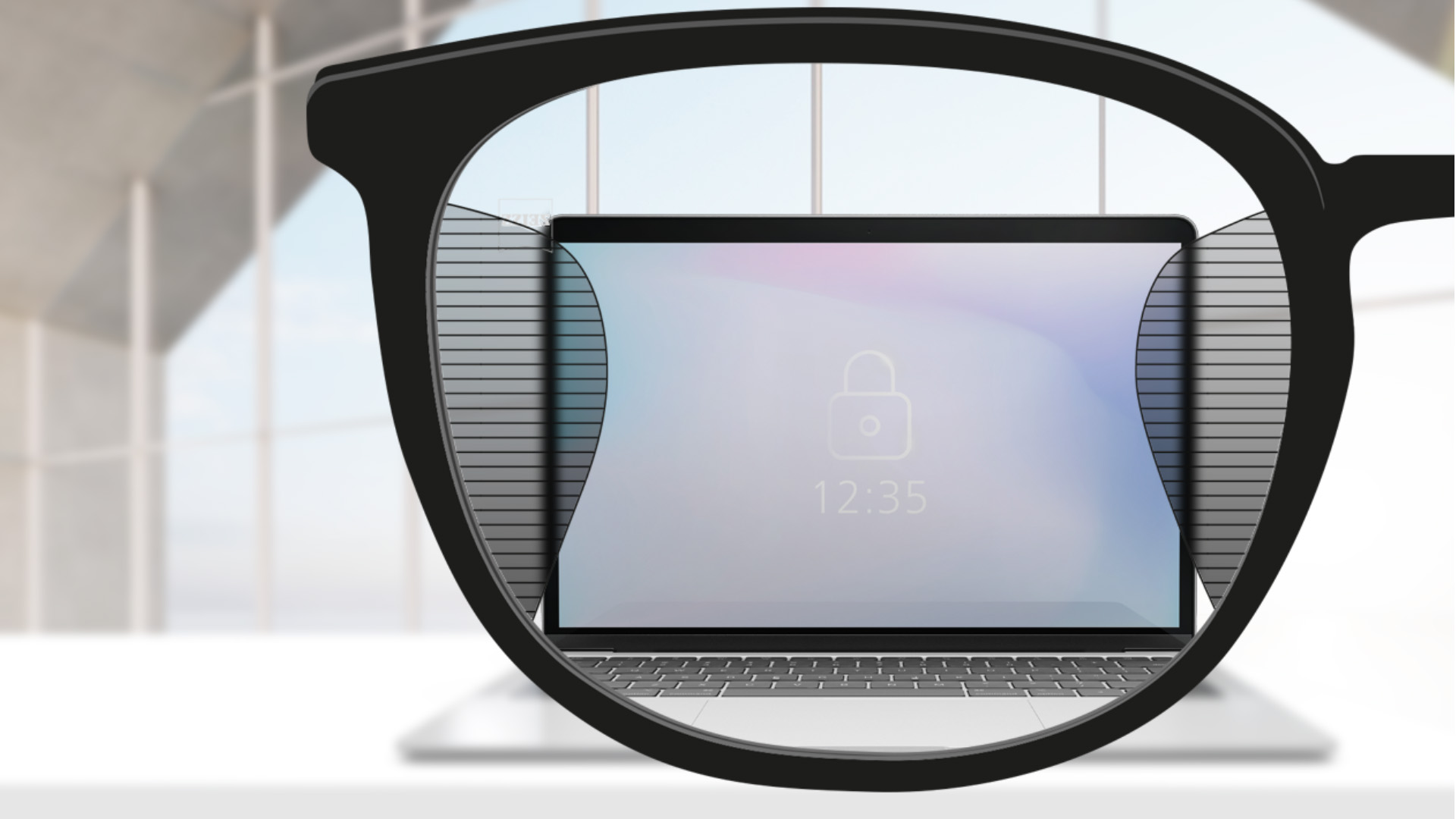 Una imagen con lentes para oficina ZEISS SmartLife con una pantalla de ordenador en el centro de la lente y zonas borrosas a izquierda y derecha.