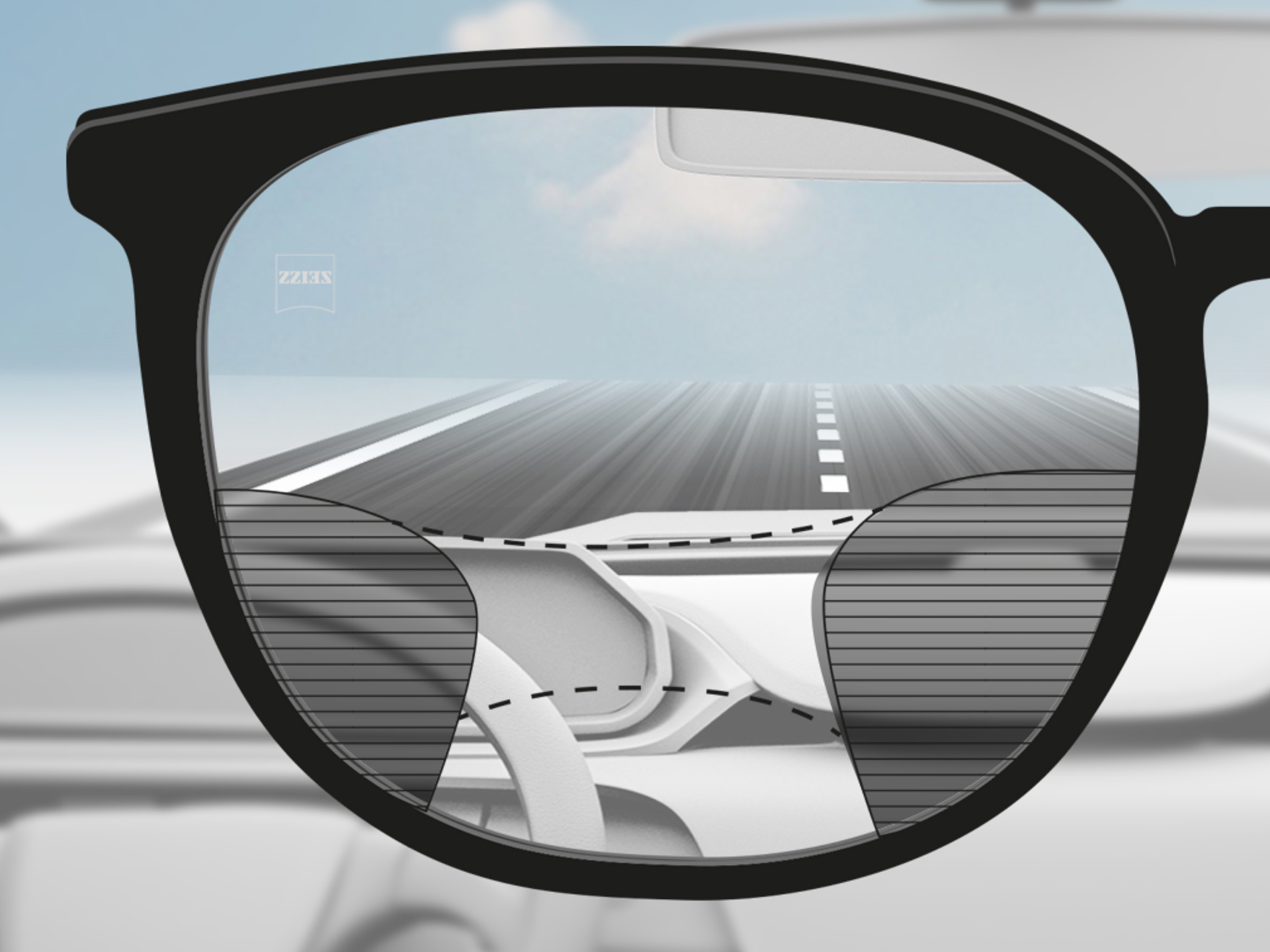 Una imagen a través de una lente progresiva ZEISS DriveSafe: las zonas de visión se han adaptado para que el conductor tenga zonas de visión claras sobre la carretera y el salpicadero.