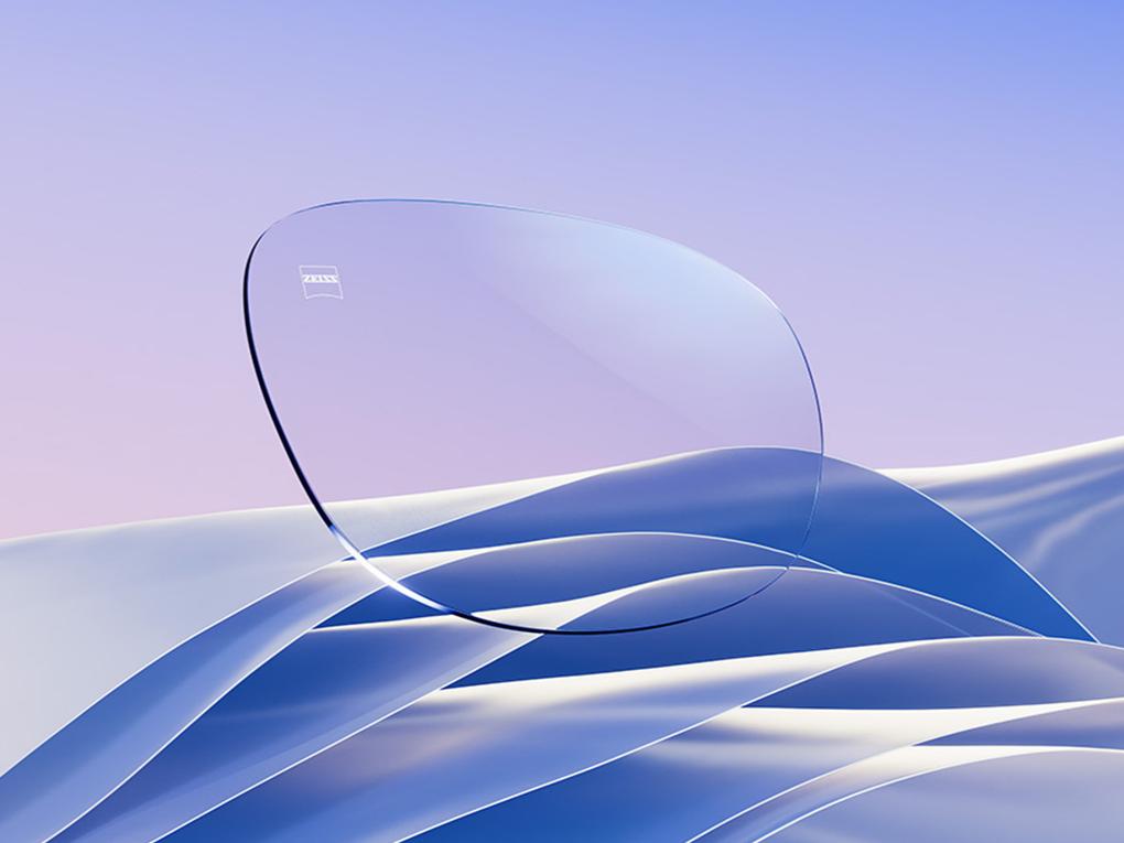 Una representación CGI de una lente transparente con un sutil reflejo blanco-azul.